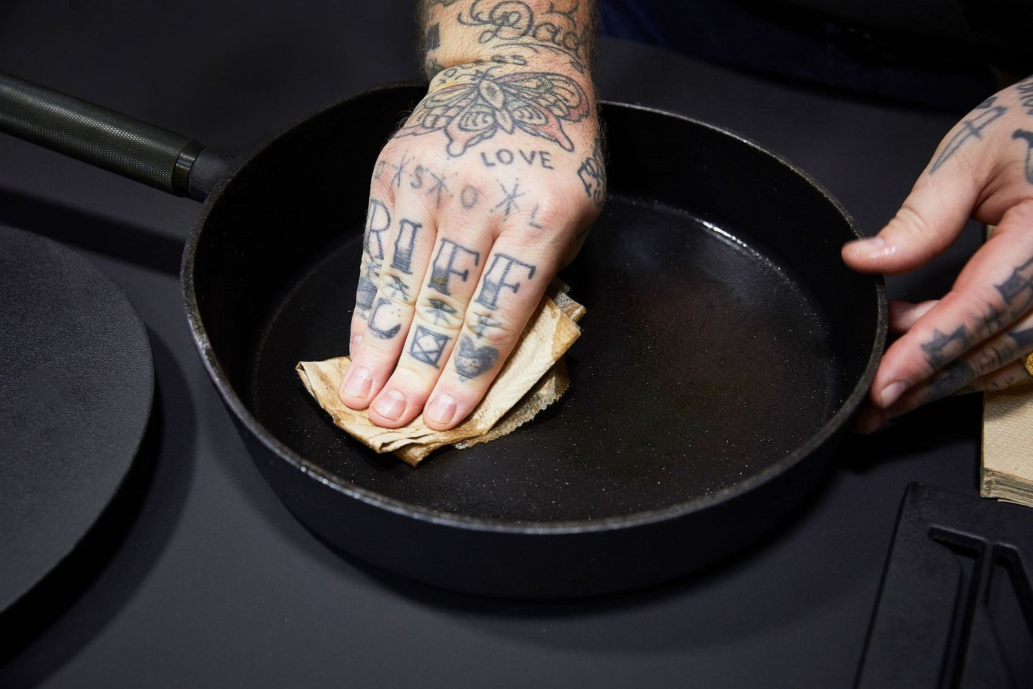 Hand cleaning a cast iron pan